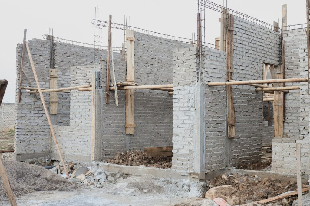 Unfinished house with brick wall